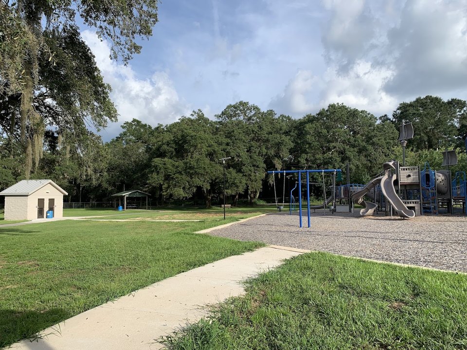 Park playground with slides and swings.